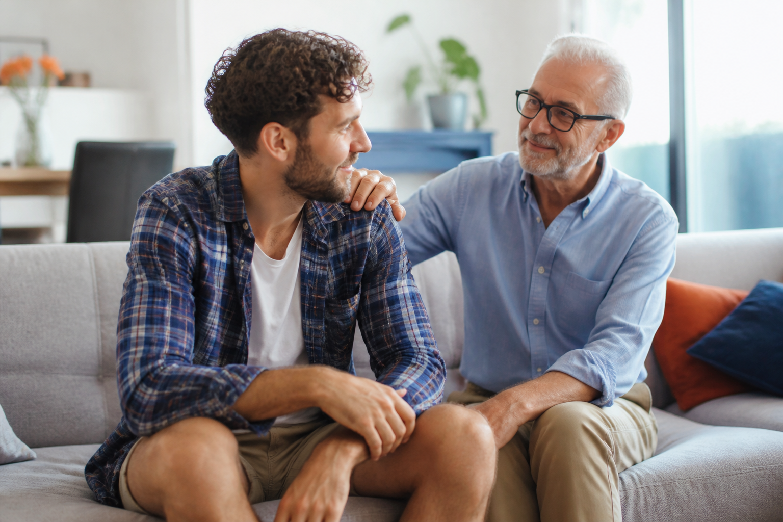 A father and son sitting together, steadying each other through a hard day.
